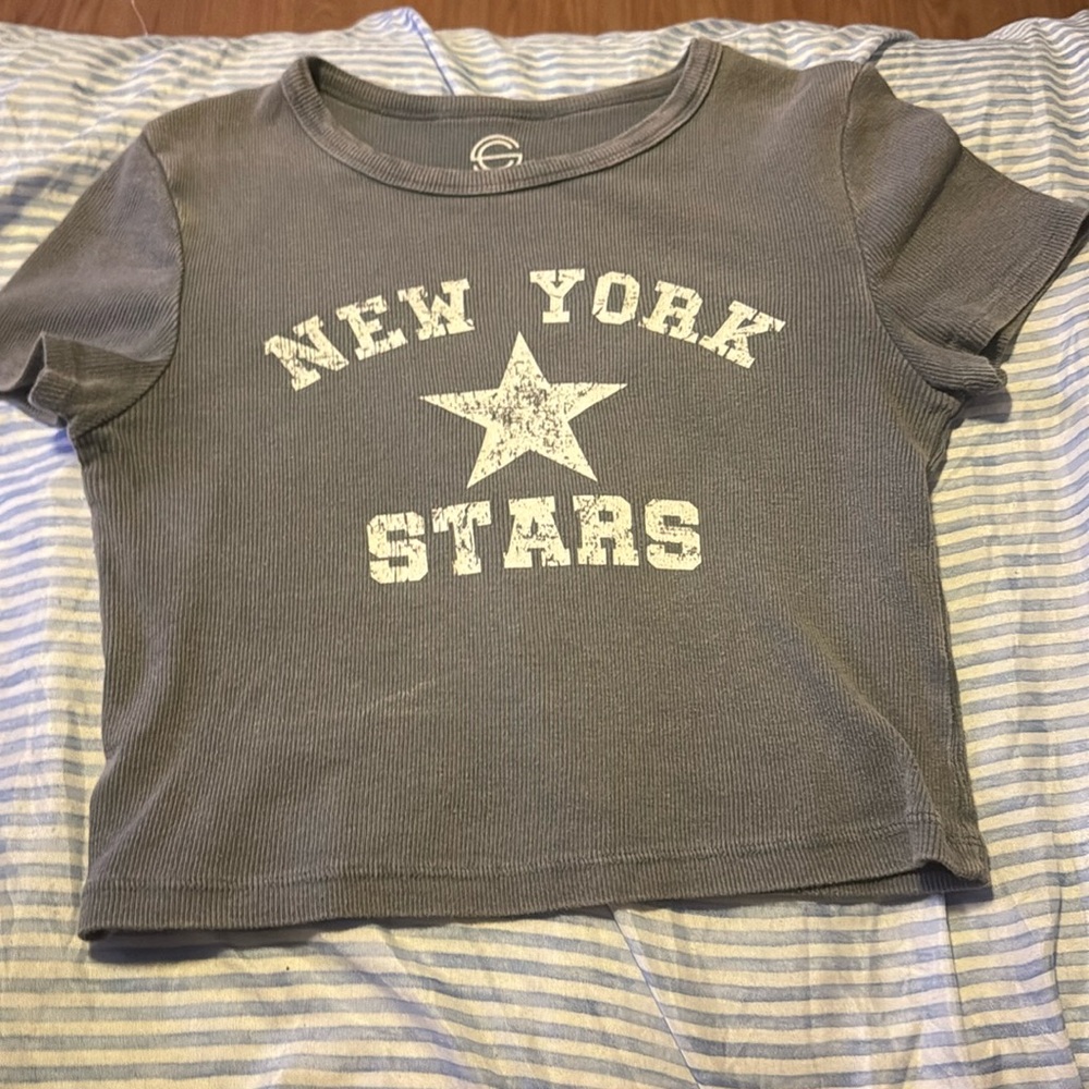 A gray and white crop-topThe brand is Social Culture